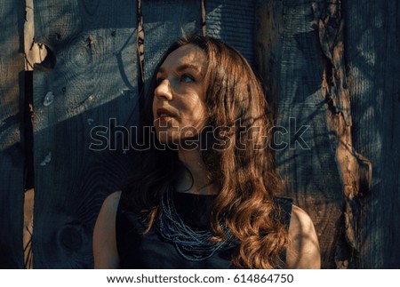 Girl in the shadow of spring branches