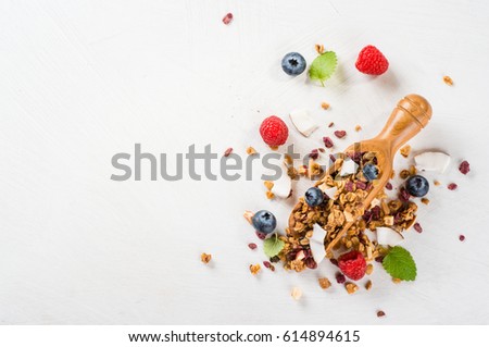 Granola from several types of cereals with nuts,coconut and dried berries Royalty-Free Stock Photo #614894615