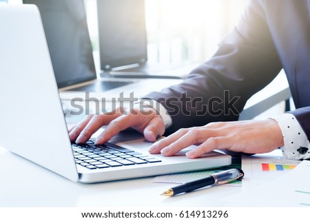 Businessman's hands typing on laptop keyboard. Business idea concept.