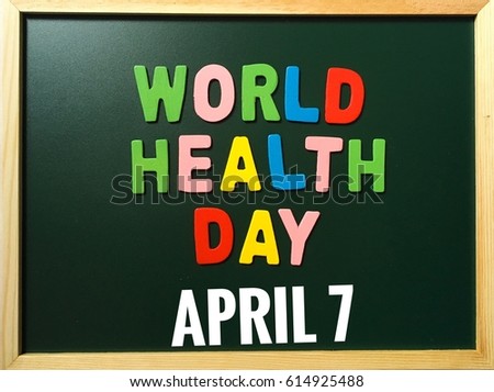 Health concept for World Health Day with wooden letters on chalkboard. The world health day is celebrates every 7th of April.