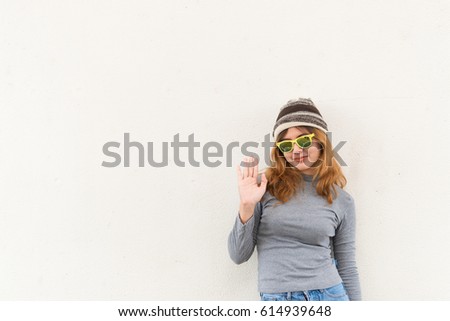 Portrait of hipster girl on white wall,lifestyle of modern teen,Cool hipster student woman wearing eyewear glasses