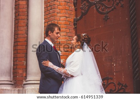 A beautiful bride and handsome groom  at church during wedding
