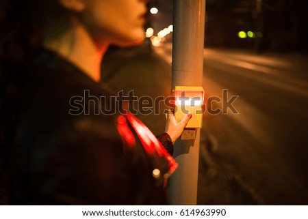 Young Businesswoman Pressing Yellow Crosswalk Button On Pedestrian Crossing