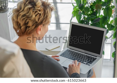 Woman working at portable device