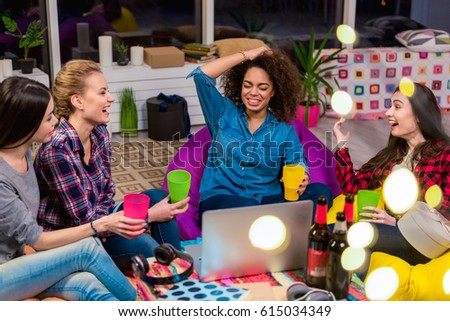Outgoing girls chatting around table