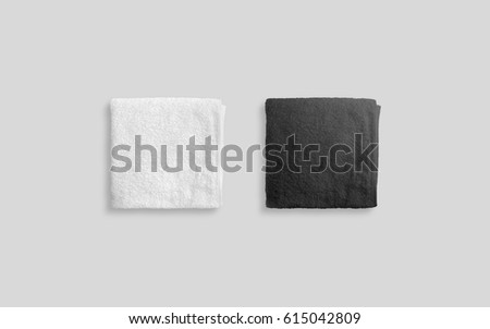 Blank black and white folded soft beach towel mockup. Clear wrapped wiper mock up laying on the floor. Shaggy fur bath textured jack-towel top view. Domestic cloth kitchen overlay template Royalty-Free Stock Photo #615042809
