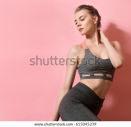 beautiful fitness woman with perfect body in shape wearing sport clothes for the gym training.  Royalty-Free Stock Photo #615045239