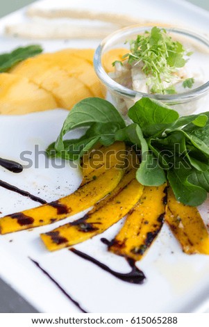 Rocket salad ,green apple salad ,grilled pumpkins ,served with diced of mangoes