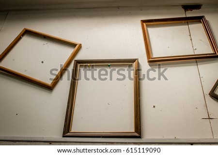 old photo frames on abstract wall