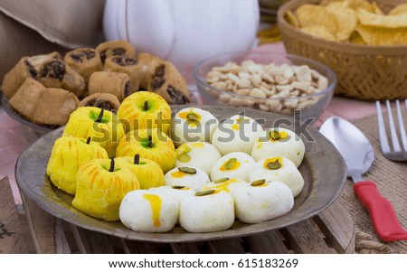 Indian Mix Sweet Food Apple Shaped Peda With White Peda Also Know as pedha, pera or peday is a prepared in thick, semi-soft pieces. the main ingredients are khoya, sugar 