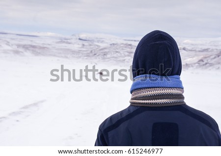 Man in wild winter iceland