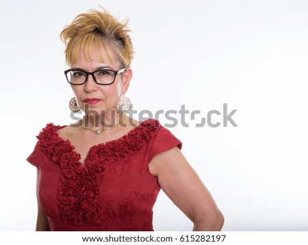 Close up of senior Asian businesswoman wearing eyeglasses against white background