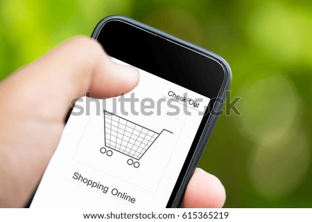 Men hand holding smartphone with online shopping application on a screen.
