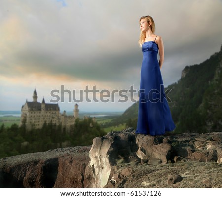 Young woman with elegant dress with castle on the background