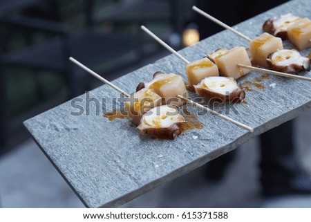 Spanish Tapas. Gastronomy, Boiled Octopus (Mollusk. Diagonal composition. Serving Food. Close up picture. Horizontal format. 