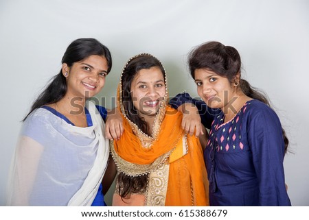 Portrait of attractive Indian three girls best friend together having fun and  take a pose for a photo.