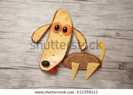 Amazing dog made of bread and cheese on board
