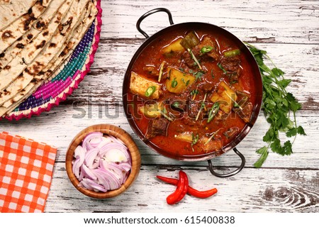 Aloo Gosht - meat curry in North Indian and Pakistani cuisine.consists potatoes aloo cooked with meat gosht Royalty-Free Stock Photo #615400838