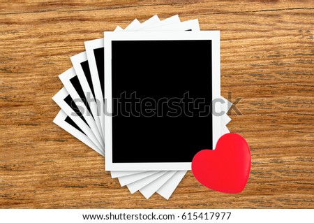 Film Vintage empty photo cards and red heart on wood background