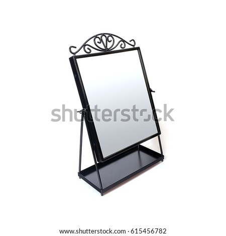 Mirror in a black metal frame isolated on a white background