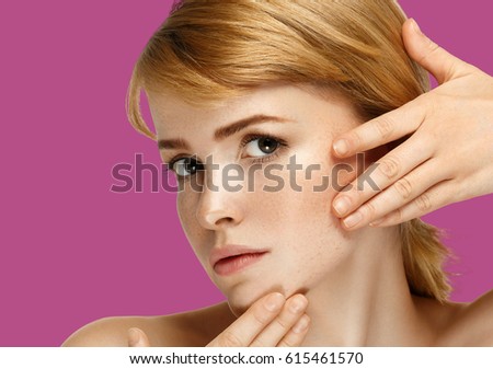 Woman cosmetic closeup beauty portrait with hand, for salon beautiful people and healthy care skin and hair over pink color background. Studio shot.