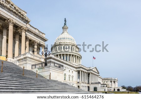 The United States Capitol Building in Washington DC stands tall on its so named hill. Royalty-Free Stock Photo #615464276