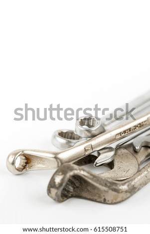 Old used wrench tools isolated over white background with copy space.