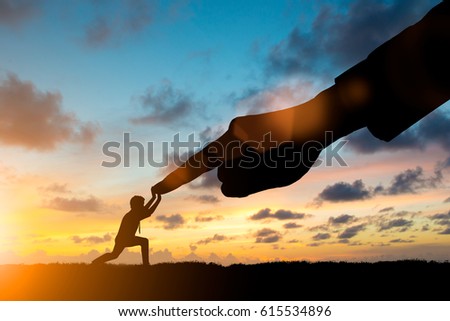 Silhouette young businessman take all his energy and production processes to fight the big capitalist over blurred sky.potential and motivate employee growth concept SME and Small Business Management Royalty-Free Stock Photo #615534896