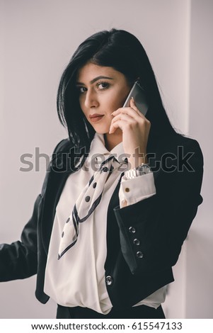 Beautiful female business owner talking n phone