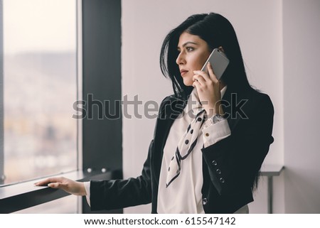 Beautiful female business owner talking n phone