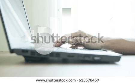 Business men's hand on keyboard with abstract financial graph ba