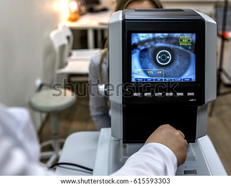 Ophthalmology - ophthalmologist checks the eyes  Royalty-Free Stock Photo #615593303