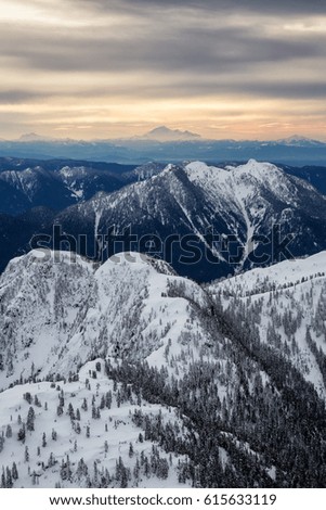 Aerial landscape view of the North Shore Mountains with Mt Baker in the background. Picture taken near Vancouver, British Columbia, Canada.