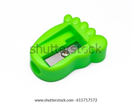 closeup image of green sharpener with isolated white background
