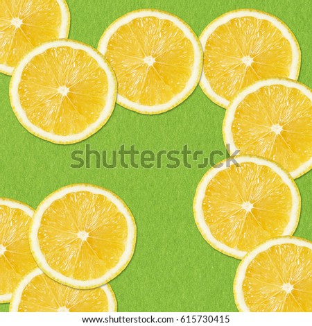 yellow lemon slices on green Background, Close-up Studio Photography