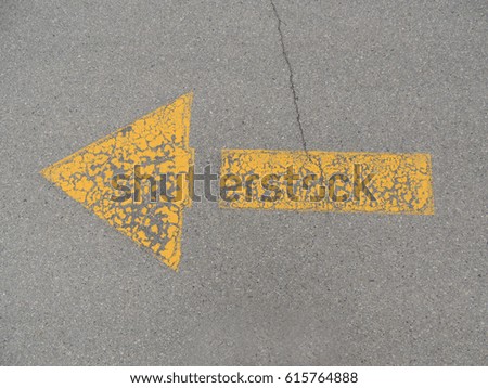 yellow arrow on road