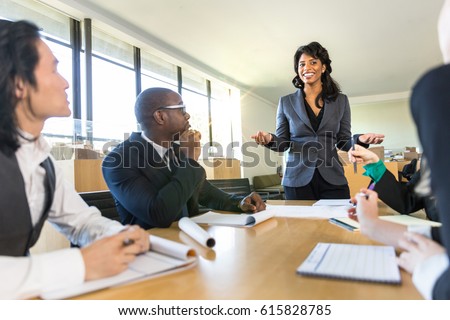 CEO boss female speaker manager presenting a lecture in the boardroom office workplace to colleagues  Royalty-Free Stock Photo #615828785