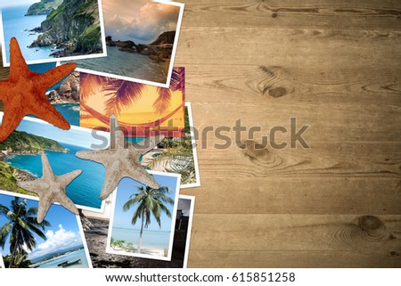 Vacation photos scattered on a wooden table. Top view and Flat lie.