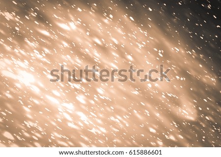 Snowflakes particles and white bokeh or glitter lights on silver background. Abstract template
