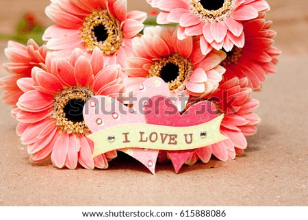 close up of I Love You with hearts and flowers
