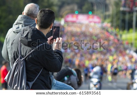 taking pictures during a marathon