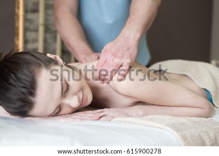 
Body care. Spa body massage treatment. Woman having massage in the spa salon Royalty-Free Stock Photo #615900278