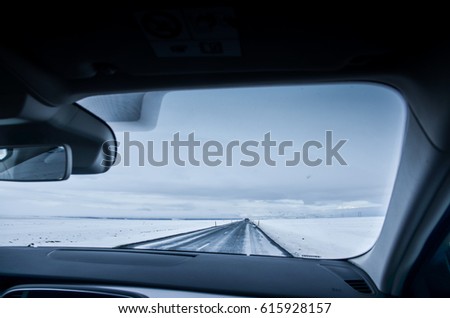 Iceland winter road from behind the car window