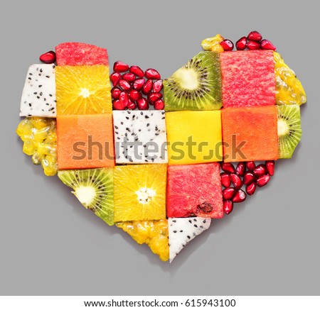 Heart Symbol Made from Different Tropical Fruits Berry Diet Concept Food Photography on Green Grunge Table High Resolution