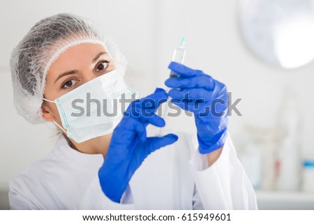 Professional nurse woman making injection in hospital