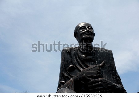 big black buddha with blue sky in Thailand