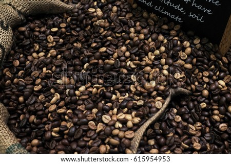 roasted coffee beans in sack bag with market copy space background 