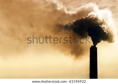 Heavy smoke from industrial chimney polluting the environment Royalty-Free Stock Photo #61596922
