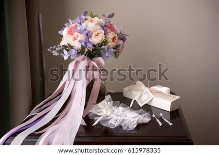 Romantic still life beautiful bridal bouquet tied with silk ribbons and love letters