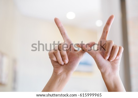 Alphabet with hands The Letter W Royalty-Free Stock Photo #615999965